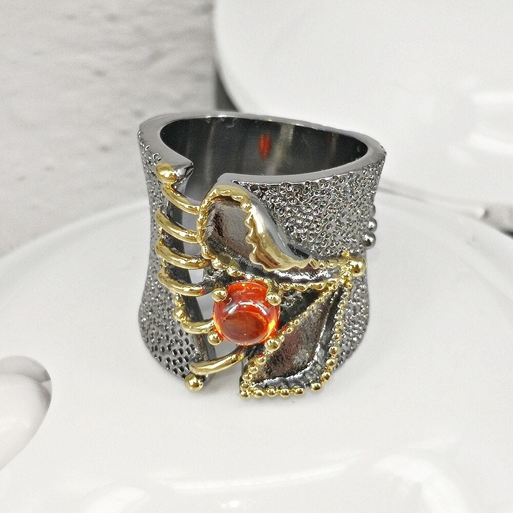 Opvallende ring met oranje siersteen