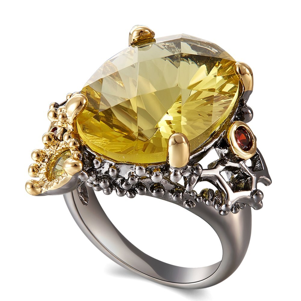 Fleurige ring met grote gele siersteen