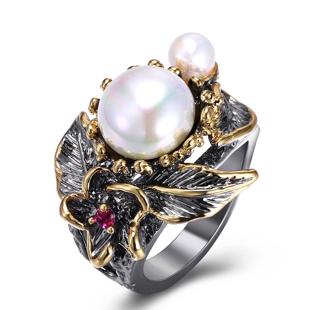 Florale ring met grote parel