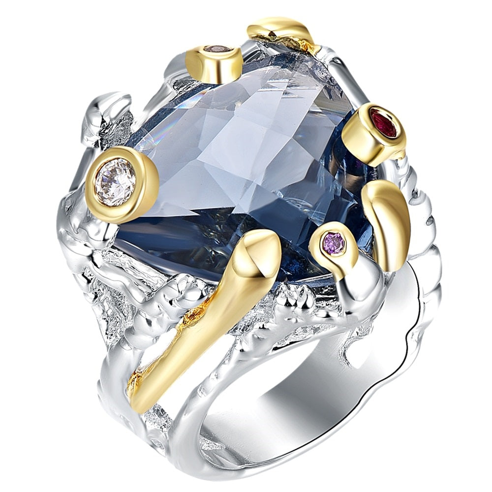Ring met grote blauwe siersteen