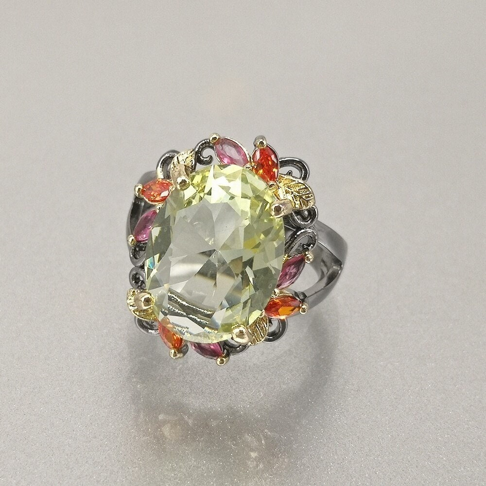 Fleurige ring met grote groene siersteen