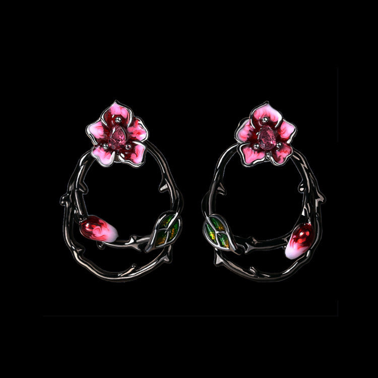 Fleurige oorbellen met roze bloesem