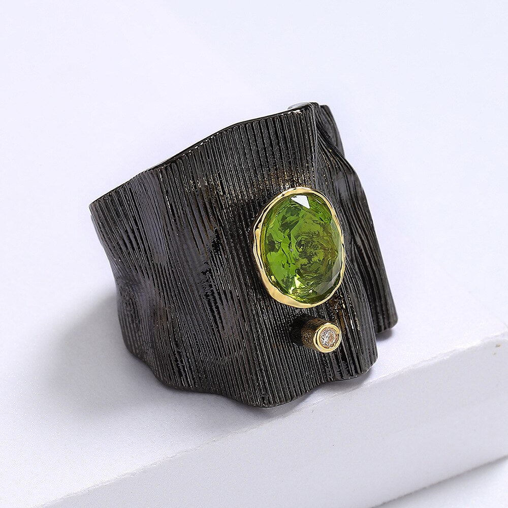 Rectangular ring with green gem