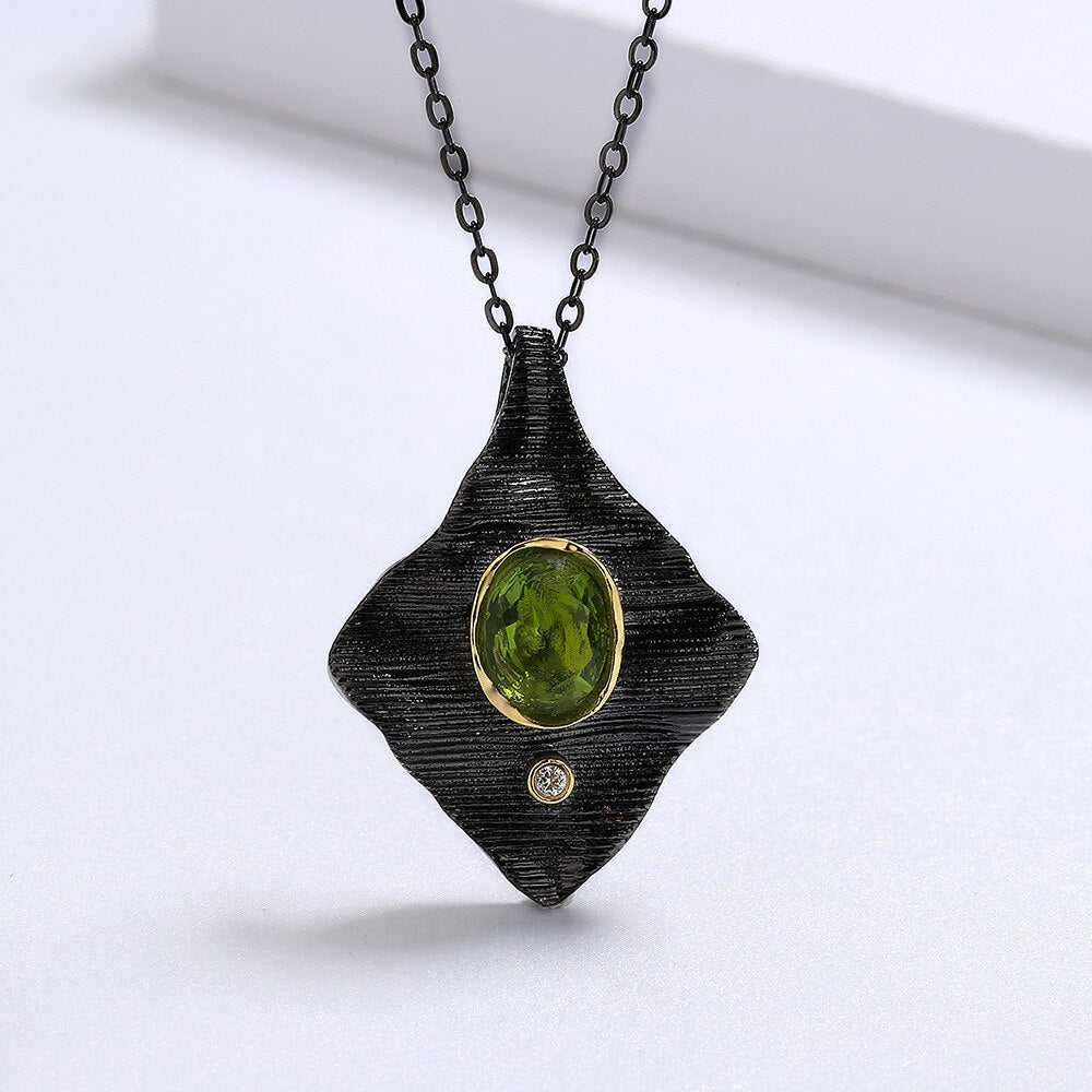Rectangular necklace with green gem