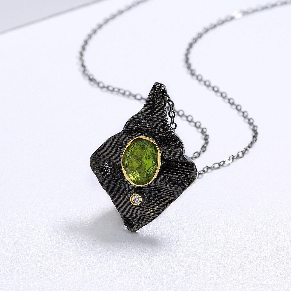 Rectangular necklace with green gem