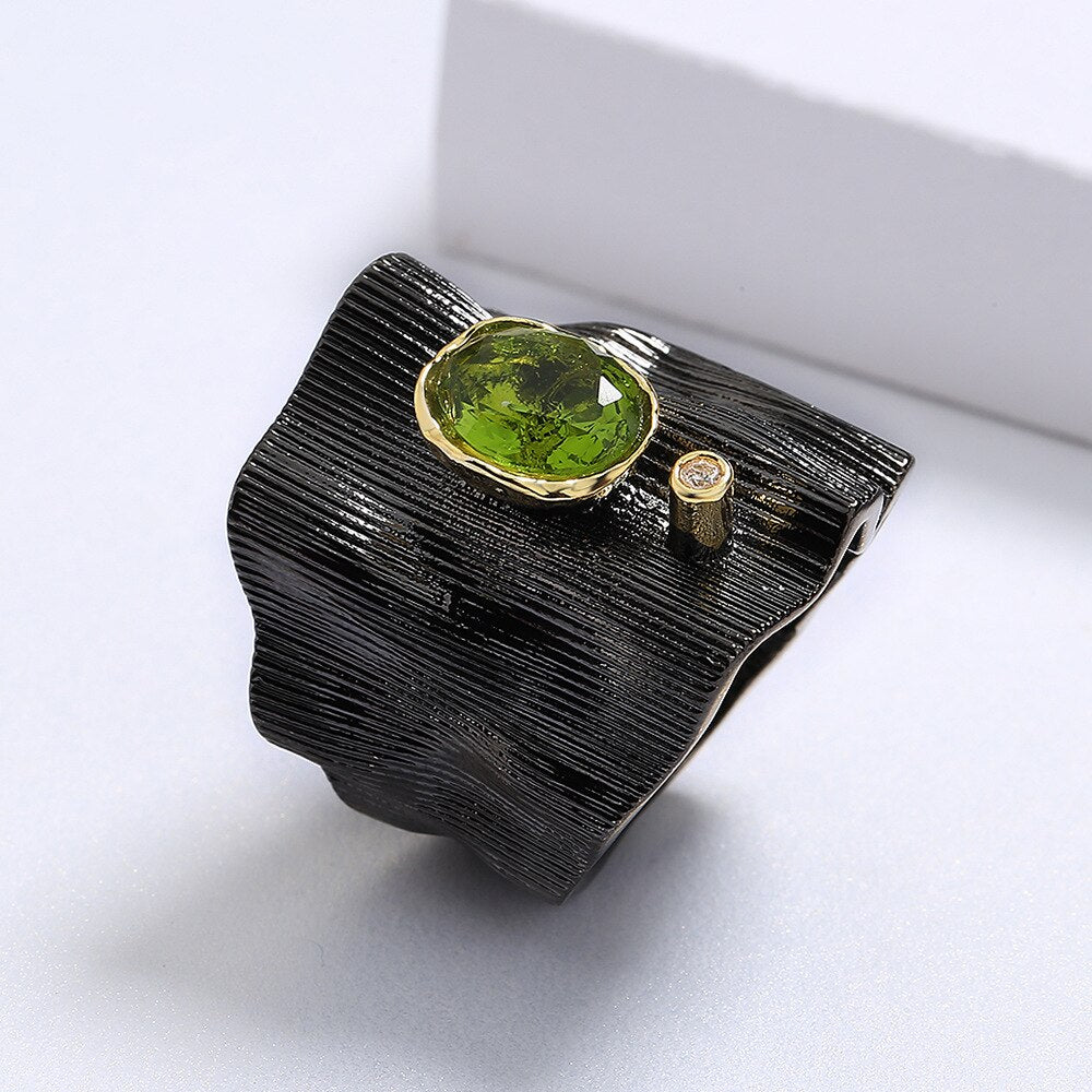 Rectangular ring with green gem