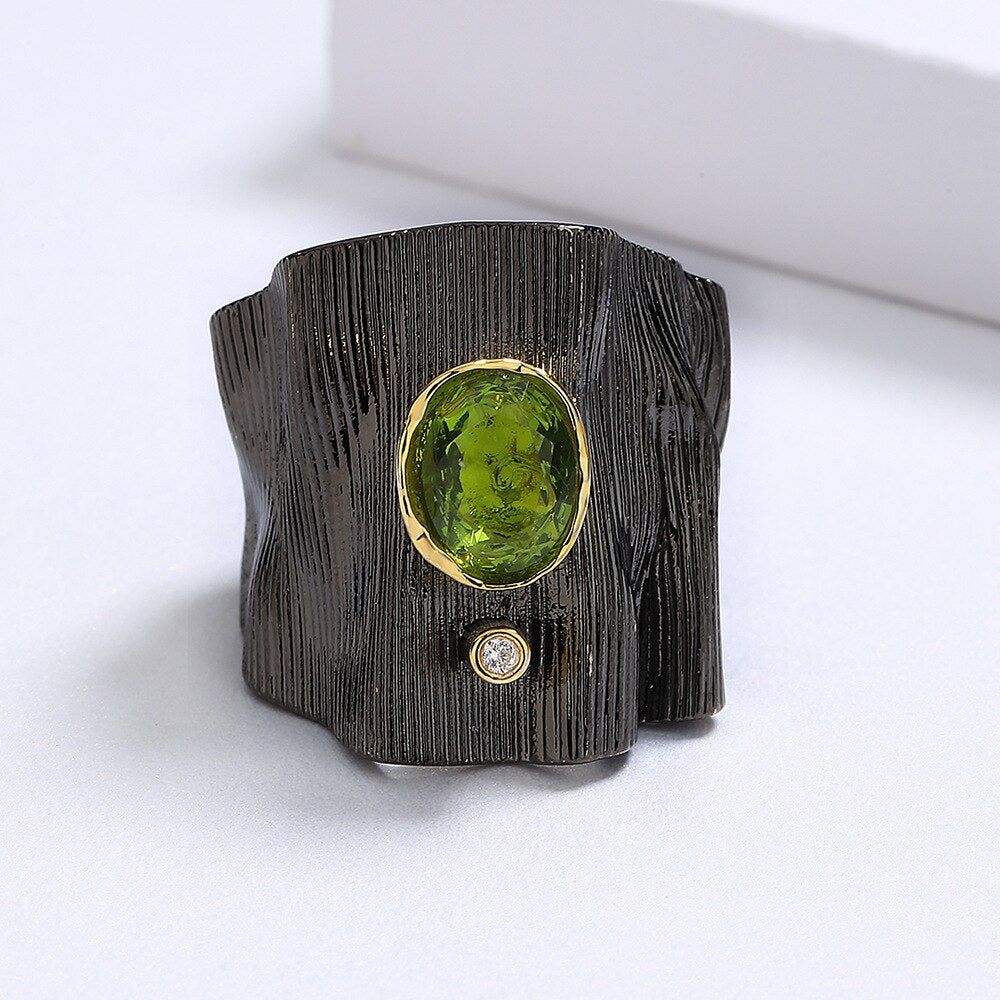 Rectangular ring with green gem