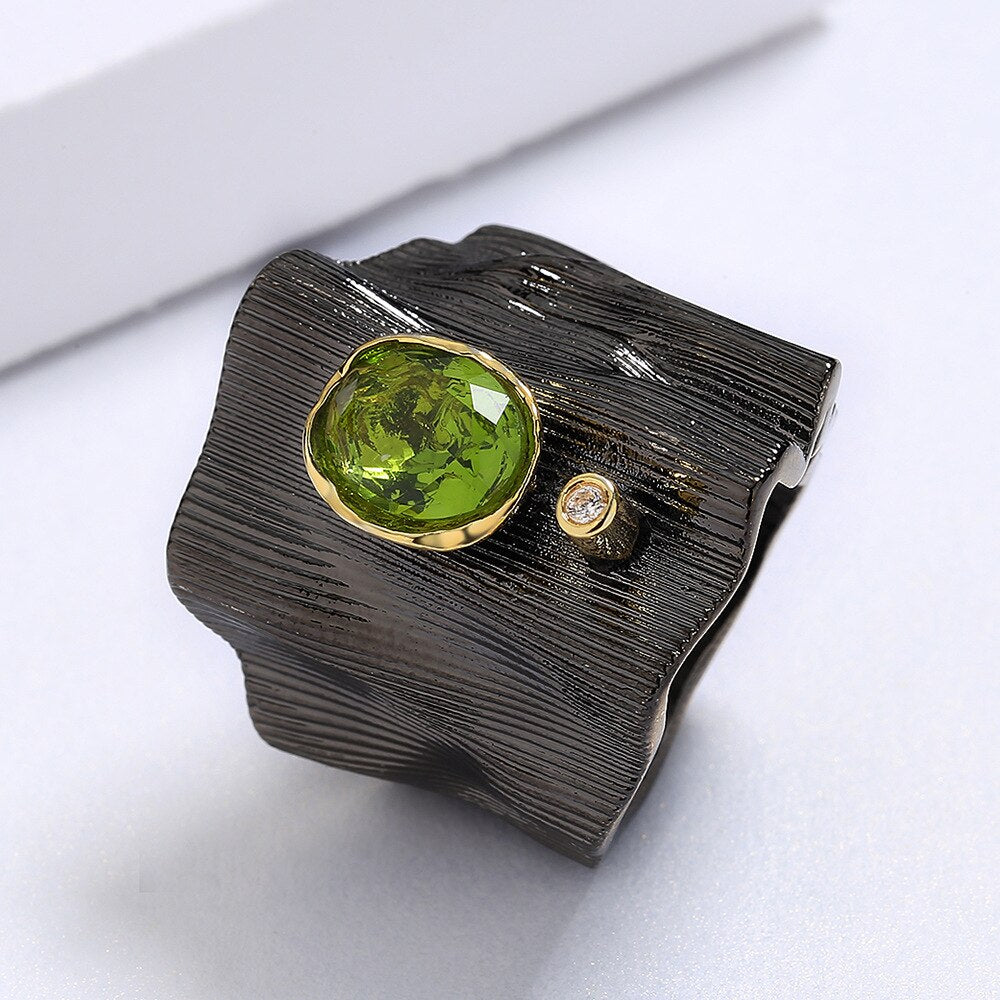 Rectangular ring with green gem