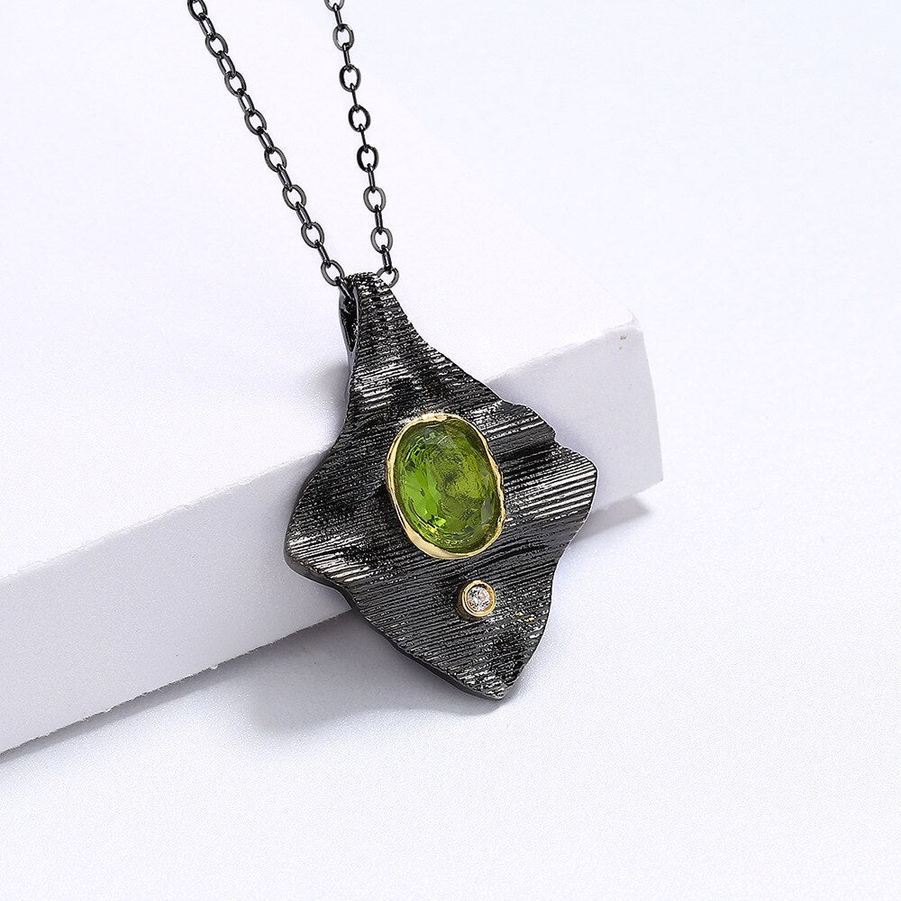 Rectangular necklace with green gem